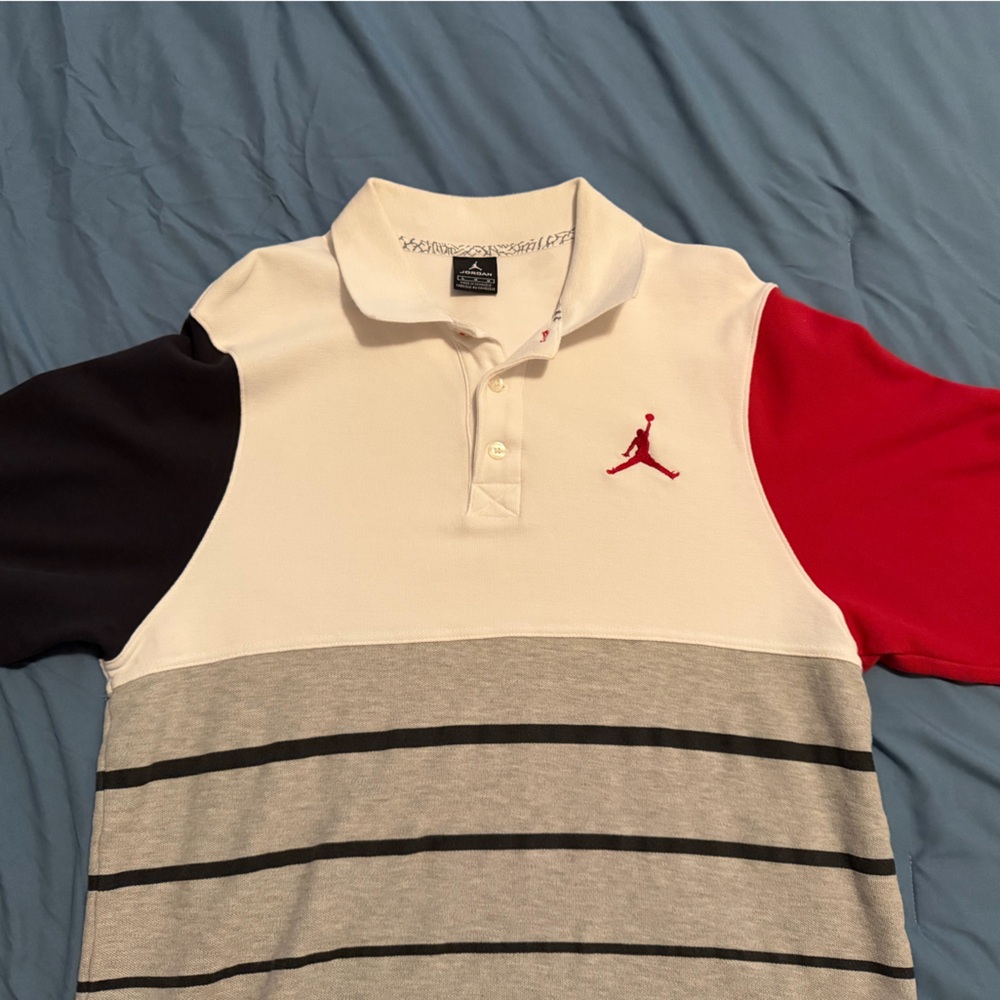 Chicago Bulls colored Jordan Polo with Red and Black Sleeves.